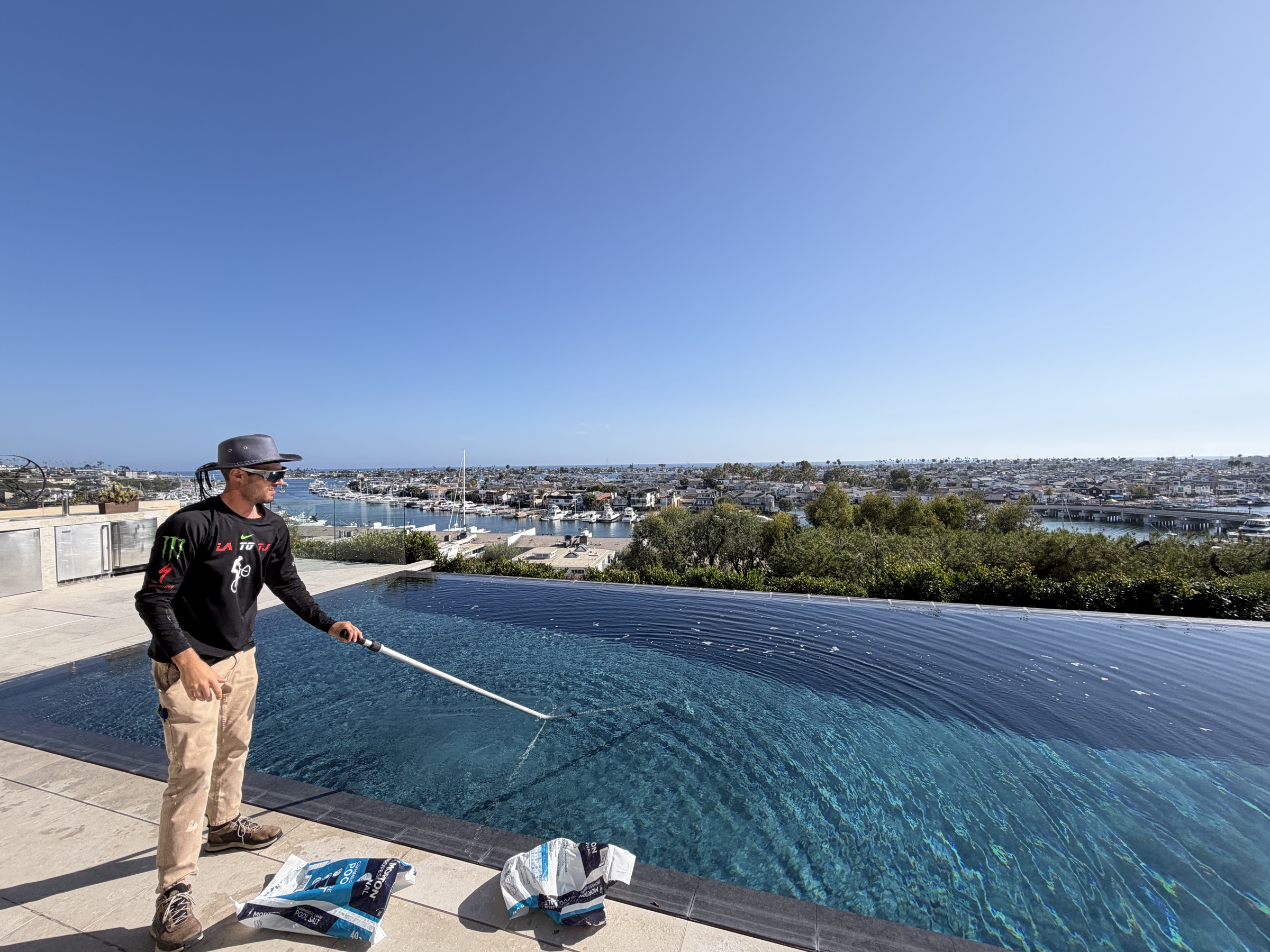 Pool service on an infinity-edge in Orange County