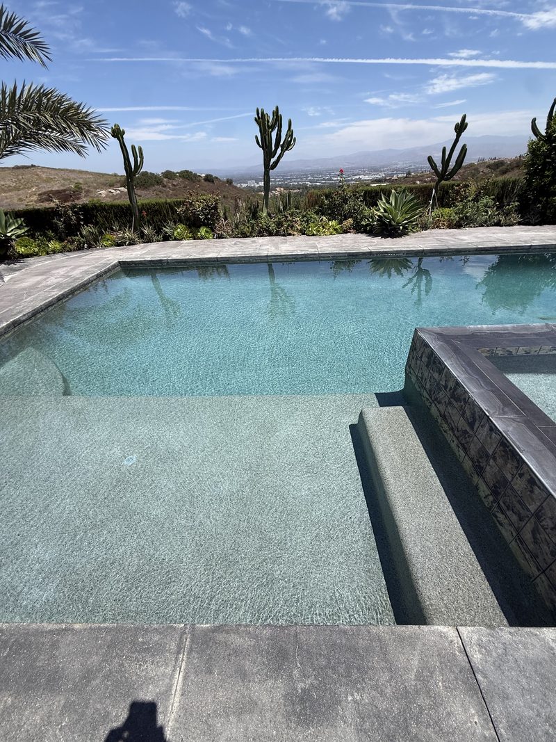 Clear pool water and spa spillway at an Irvine estate