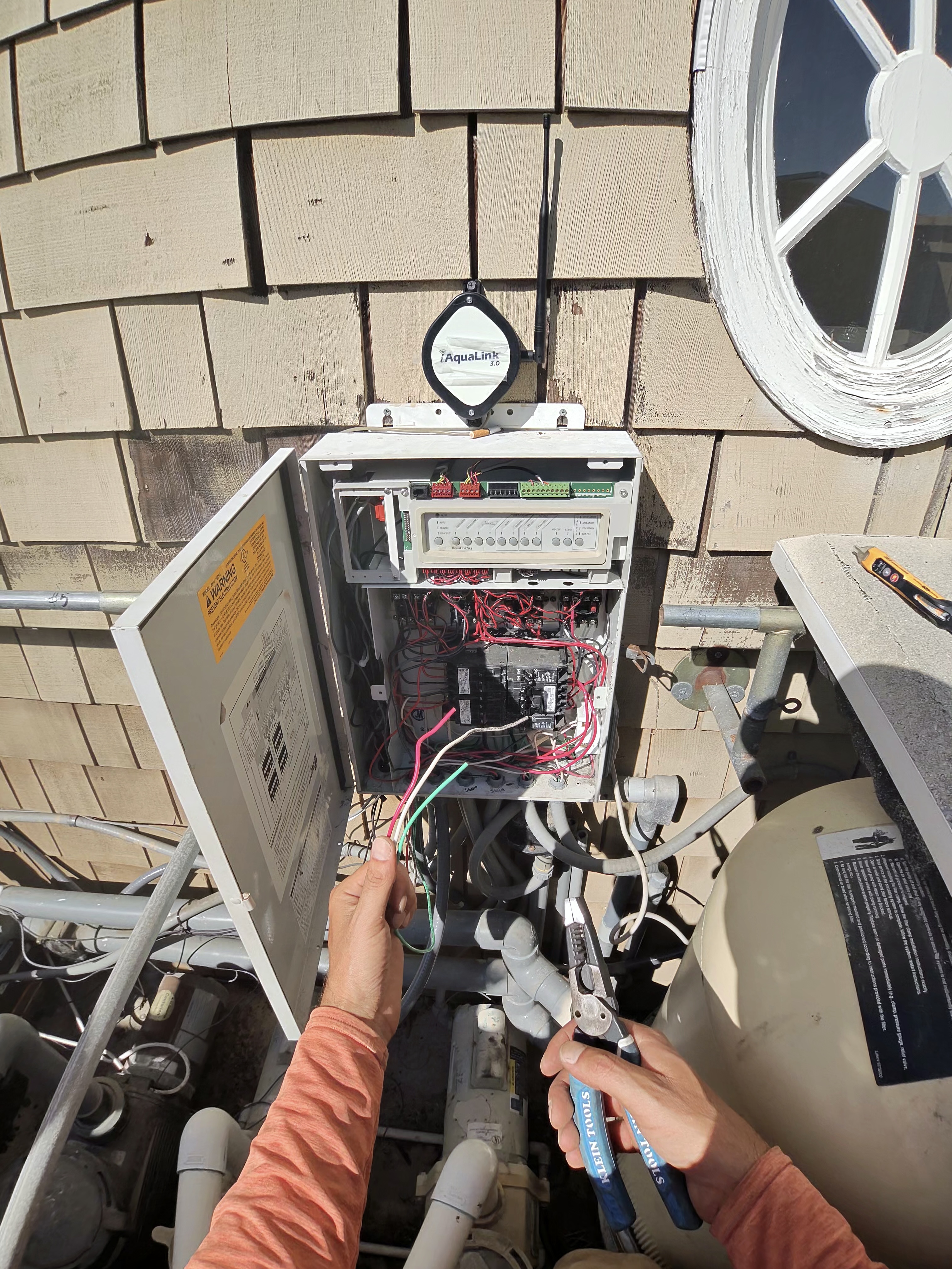 Open pool control center with iAquaLink 3.0 during equipment repair