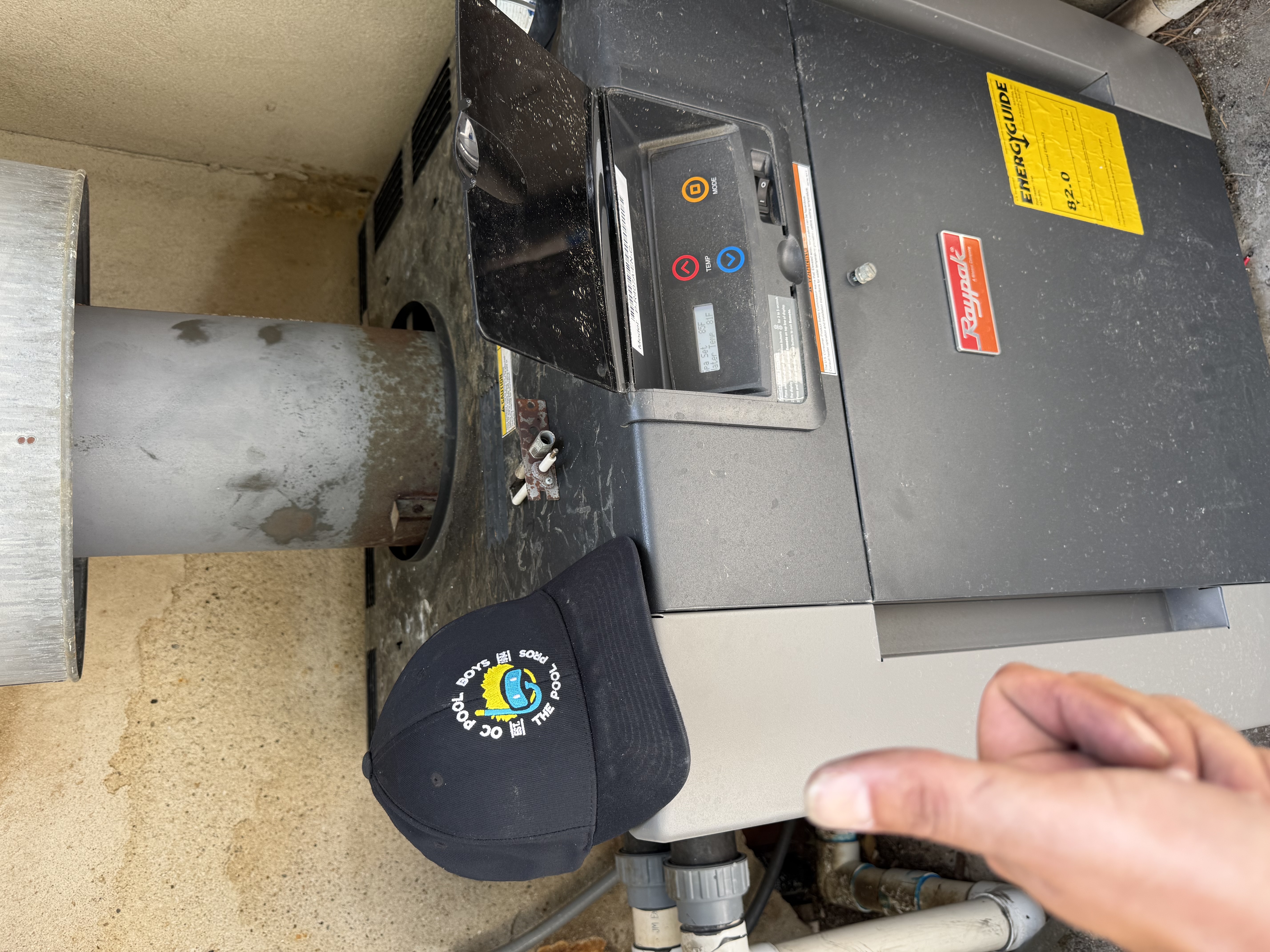 Serviced Raypak pool heater with OC Pool Boys hat